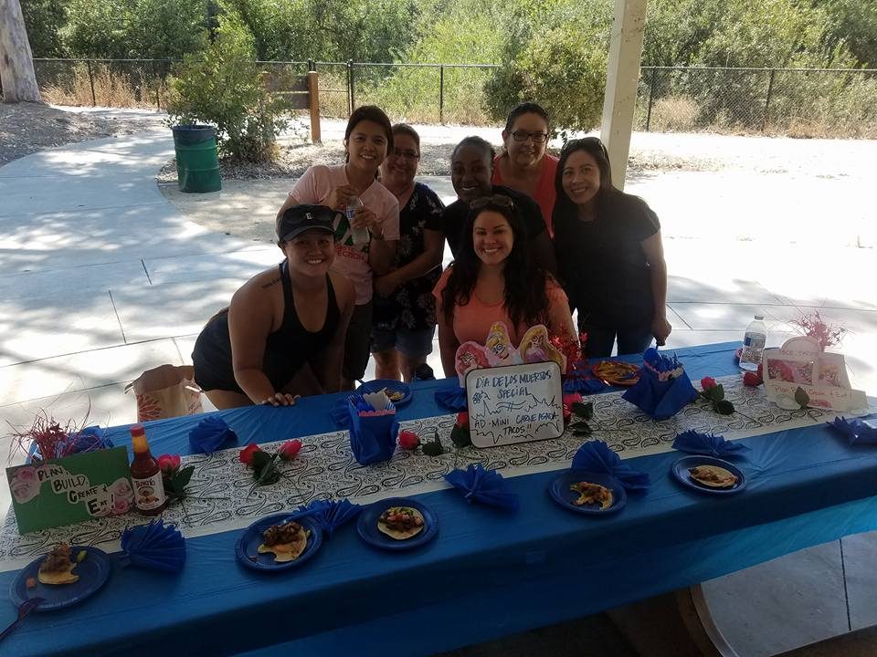 The team behind a table full of creations.